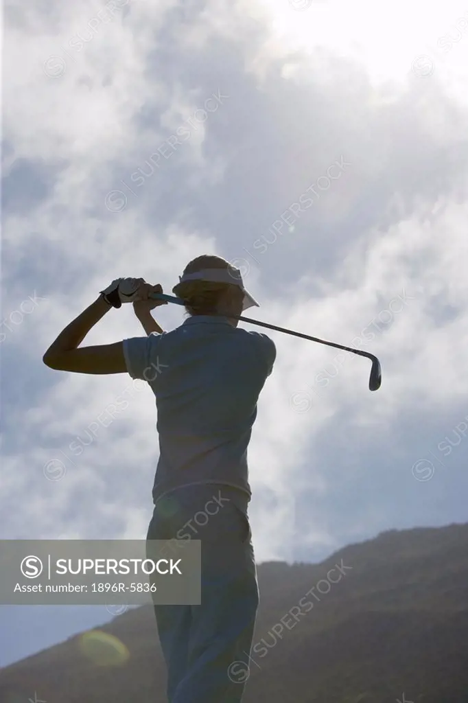Low Angle View of Woman Golfer Silhouetted  Clovelly Golf Course, Cape Town, Western Province, South Africa