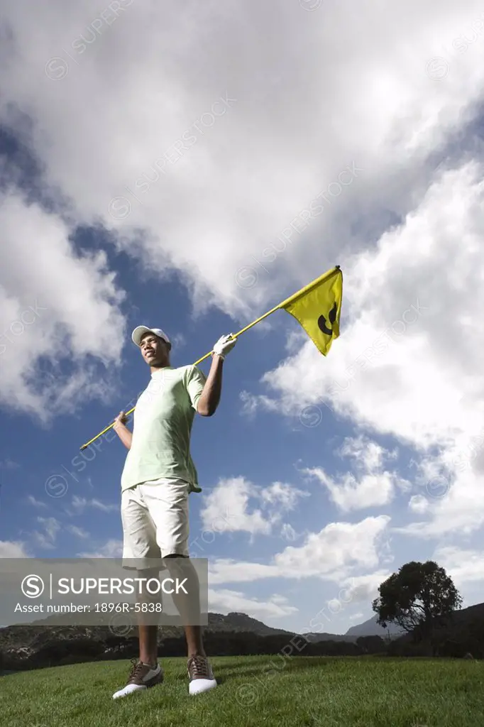 Low Angle View of Woman Holding Flag Stick  Clovelly Golf Course, Cape Town, Western Province, South Africa