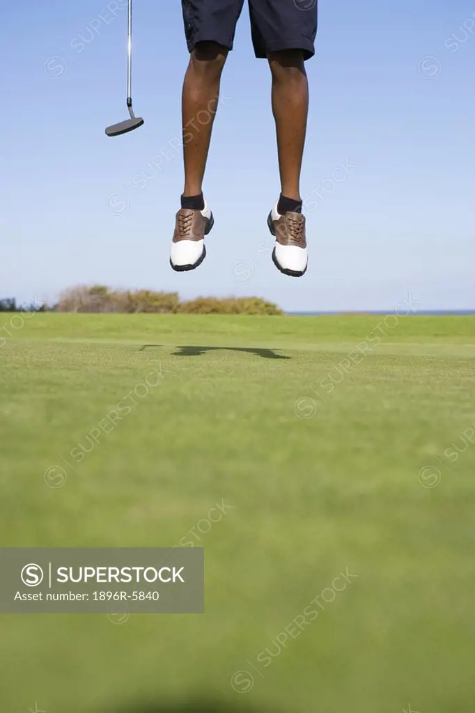 Low Section of Man Jumping  Clovelly Golf Course, Cape Town, Western Province, South Africa