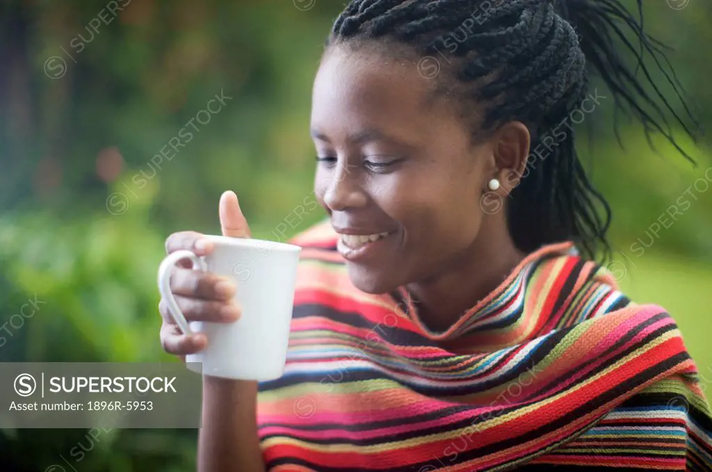Woman drinking coffee, Pietermaritzburg, KwaZulu_Natal Province, South Africa