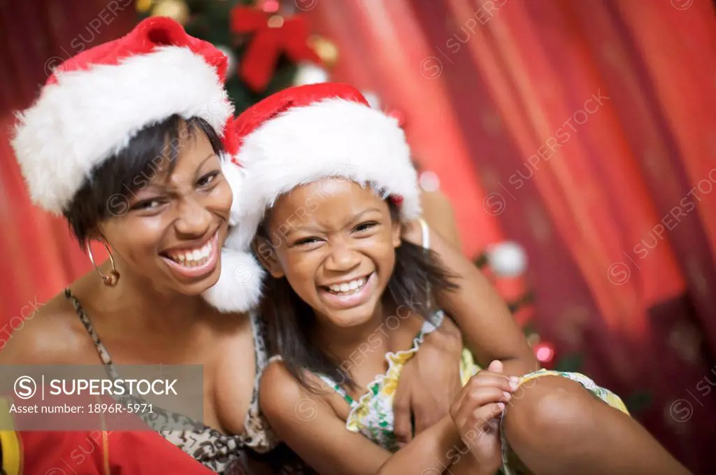 Mother and daughter laughing at Christmas, Pietermaritzburg, KwaZulu_Natal Province, South Africa