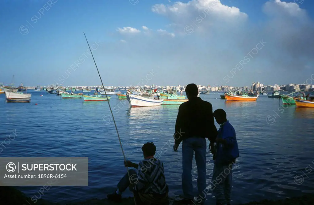 Three Men Fishing in the Harbour  Alexandria, Egypt