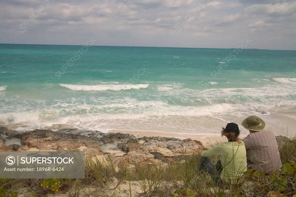Couple admiring the ocean view from Ciego De Avila, Cuba.