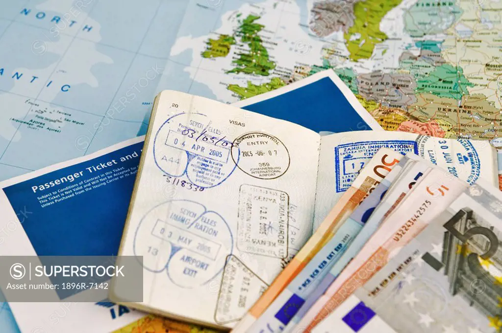 Airline Ticket with Passport and Foreign Currency  Studio Shot