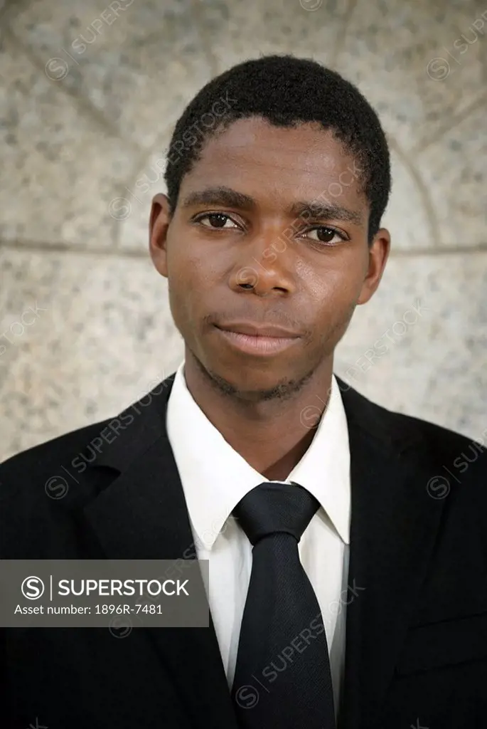 Portrait of young black man wearing full suit, Cape Town, Western Cape Province, South Africa