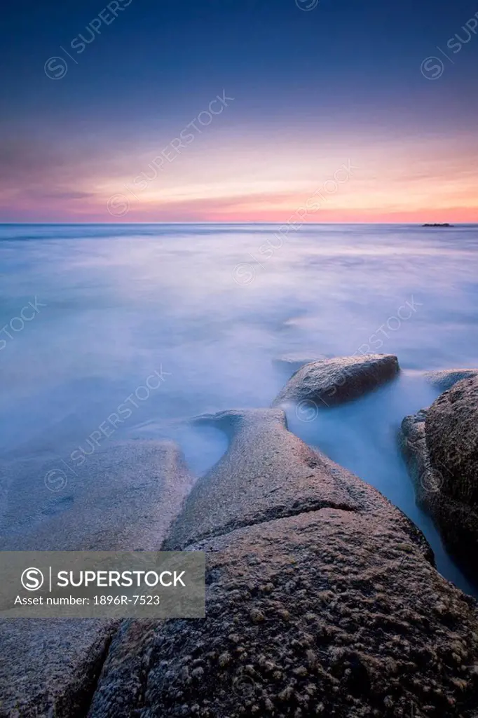 Surf on rocks with horizon at sunset, Clifton, Western Cape Province, South Africa