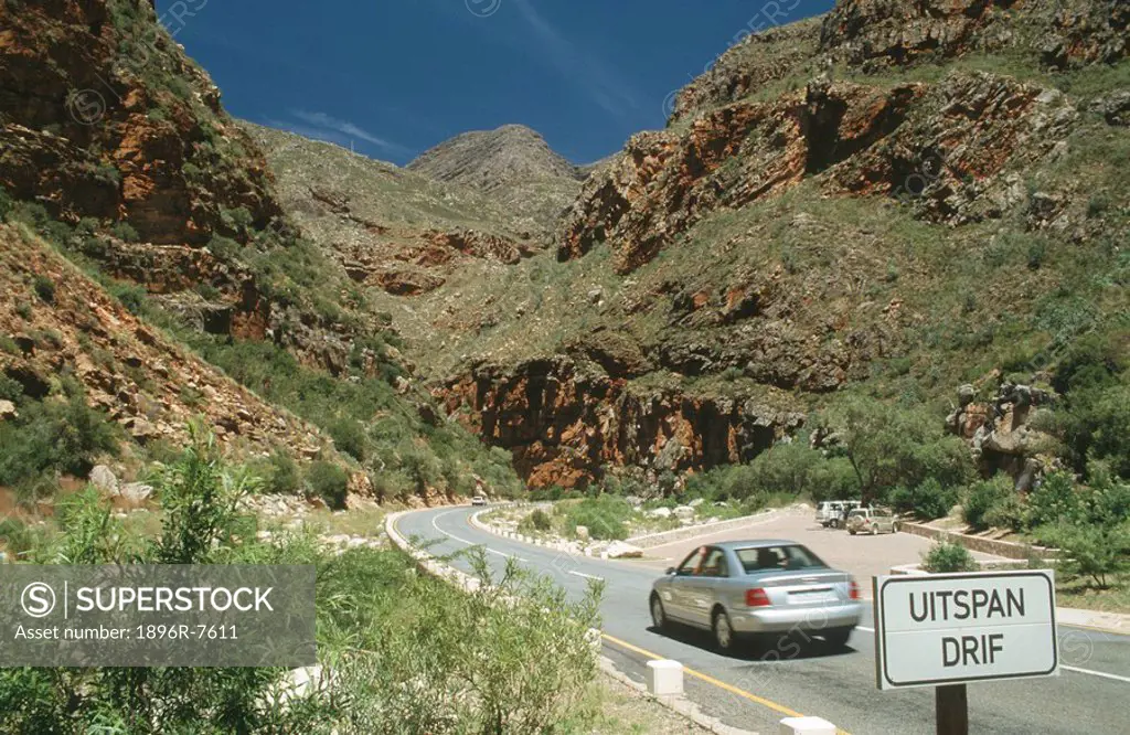 Car on road through Meiringspoort Pass, Western Cape Province, South Africa