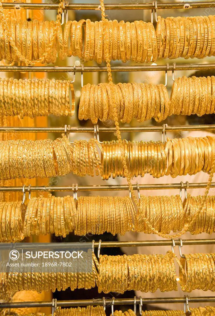 Rows of gold bracelets in Gold Souk, Deira district, Dubai, United Arab Emirates