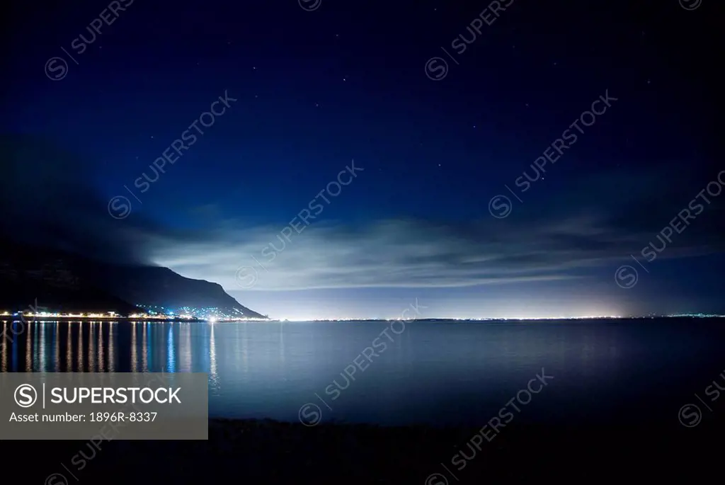Muizenberg peak silhouetted by city at Kalk Bay, Muizenberg, Cape Peninsula, Western Cape Province, South Africa