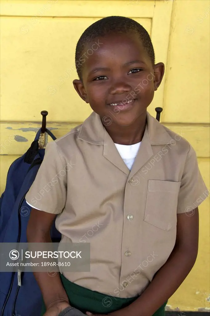Portrait of schoolboy standing outside his classroom, KwaZulu Natal Province, South Africa