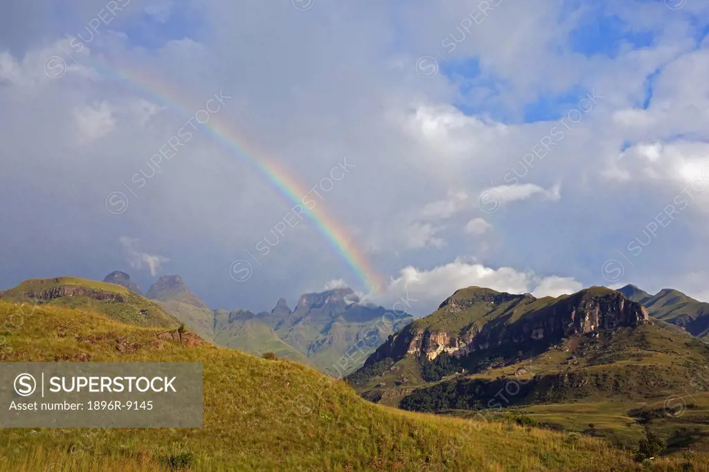 Rainbow over Inner and Outer Horn, the Bell and Cathedral Peak, Drakensberg, KwaZulu Natal Province, South Africa