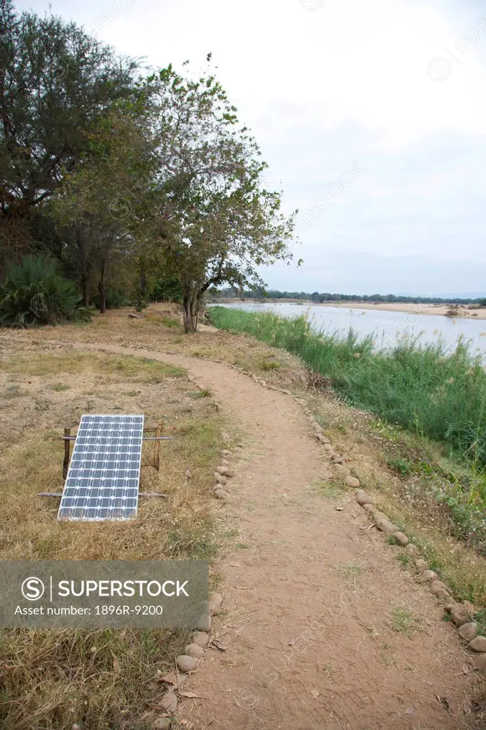 View of a solar panel along the walkway of a safari camp, Luangwa Valley, Zambia