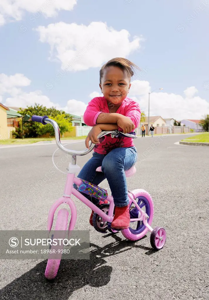 Young girl on her bicycle, Cape Town, South Africa