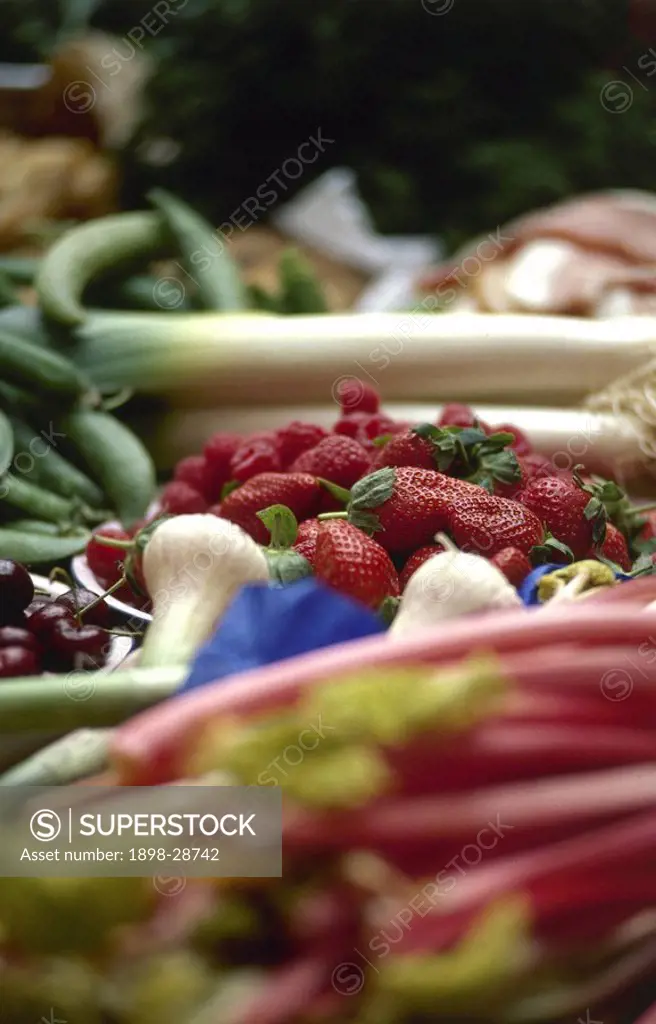 Fresh fruits and vegetables laid out on a table.