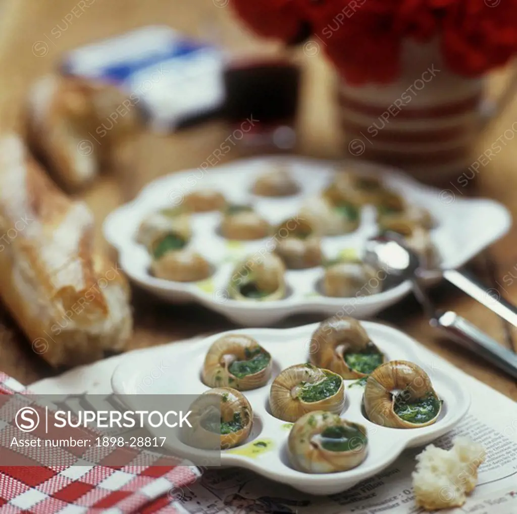 Escargots Maison on a country table, edible snails