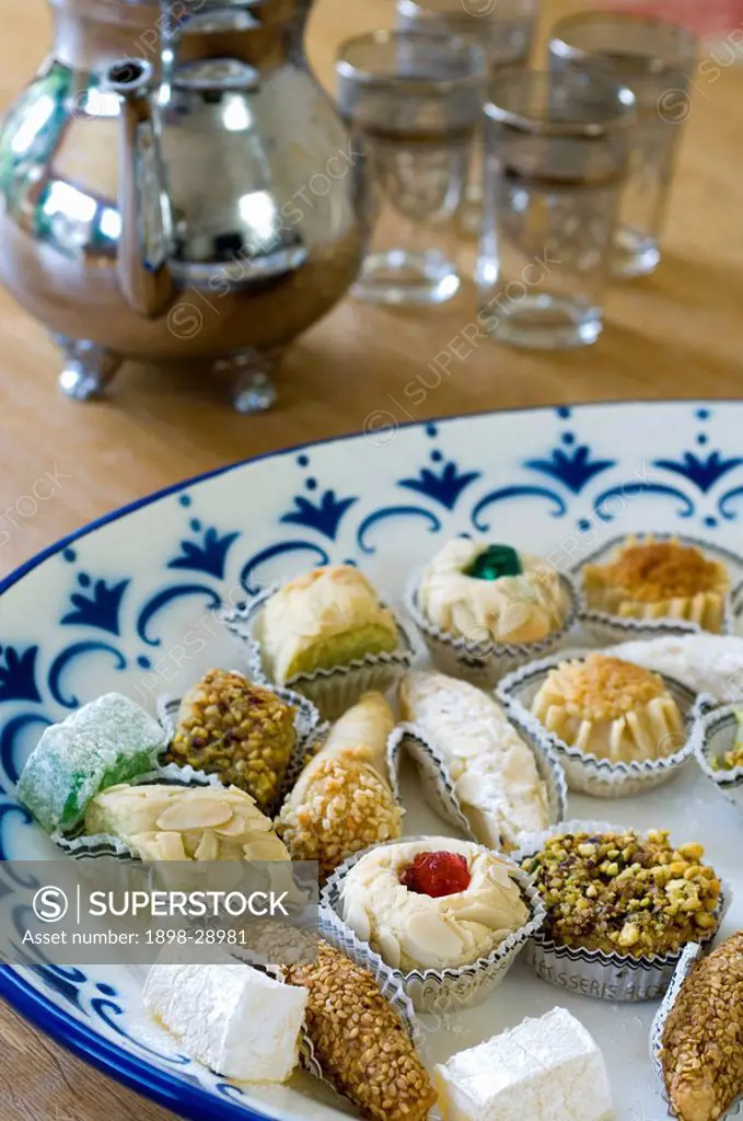 Plate of petits fours on blue and white plate