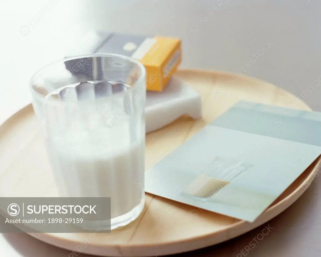 Beaker filled with milk, wooden tray , Interiors, detail, drinks,
