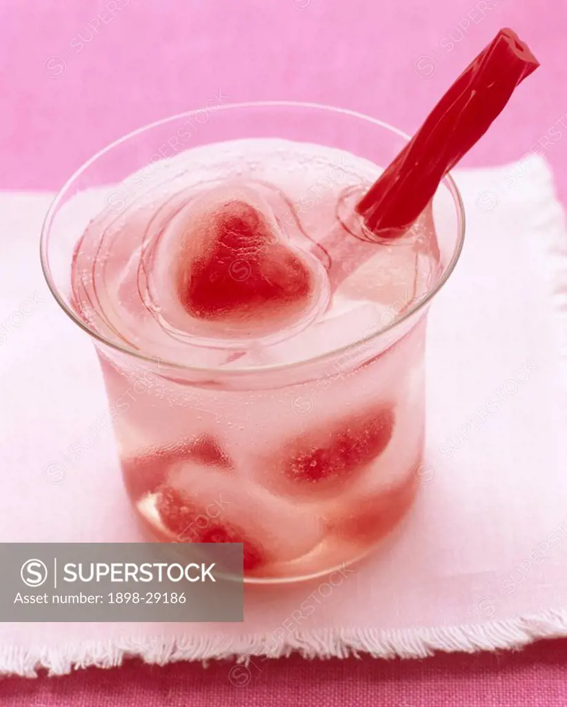 Strawberry fruits in ice cubes glass