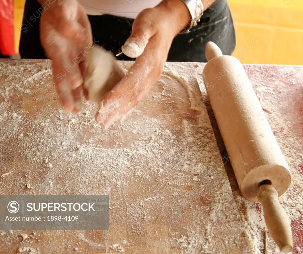 Making Homemade Naan Bread - Rolling Naan Bread dough in hands
