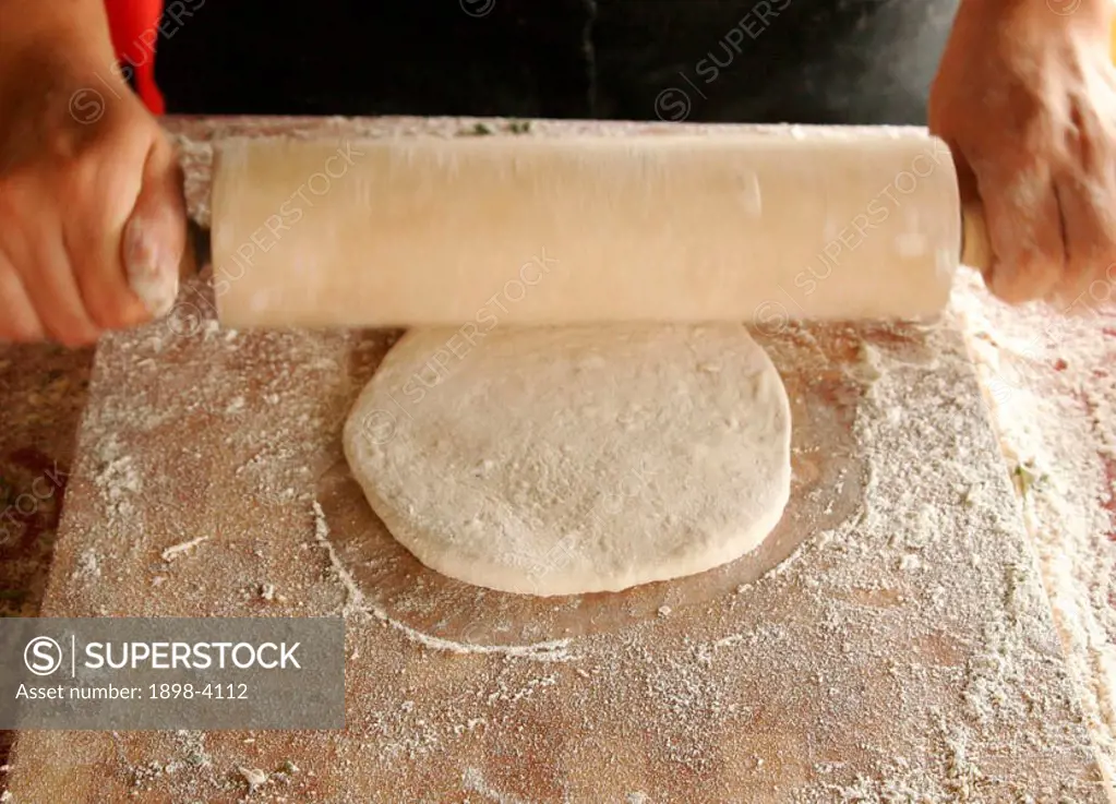 Rolling naan bread dough
