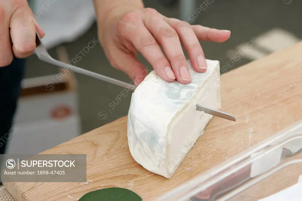 Slicing Camembert Cheese