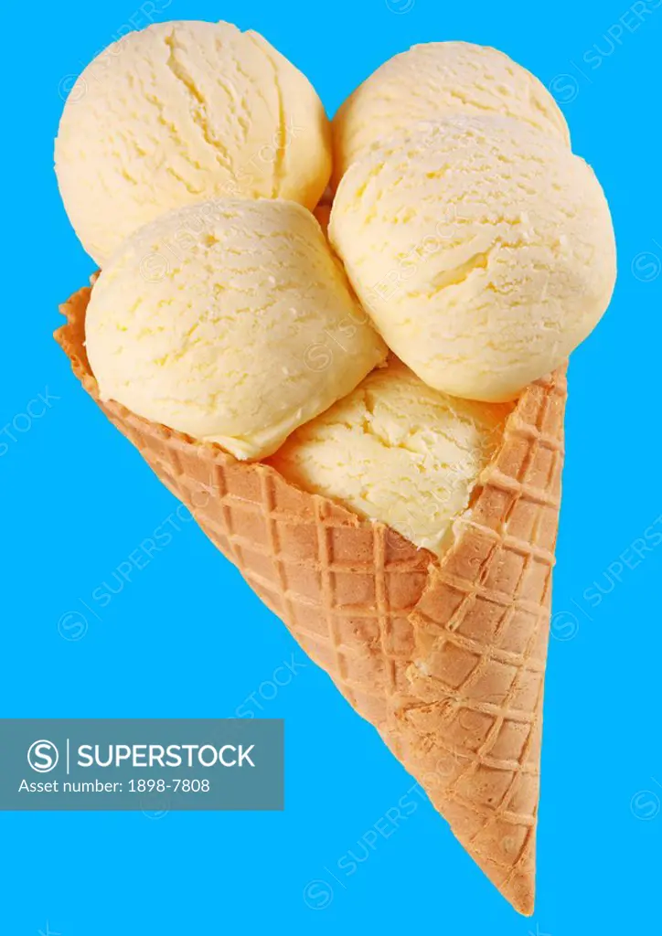 VANILLA ICE CREAM SCOOPS IN CONE ON BLUE