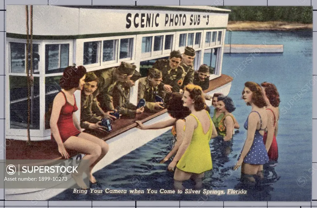 Women Talking with Soldiers at Scenic Attraction. ca. 1943, Silver Springs, Florida, USA, Bring Your Camera when You Come to Silver Springs, Florida. FLORIDA'S INTERNATIONAL ATTRACTION. SEE SILVER SPRINGS. 'Nature's Underwater Fairyland' Largest flowing springs in the world, over 750 million gallons daily. Electric driven glass bottom boats. Greatest depth 80 feet. Temperature of water 72 degrees winter and summer. Shown from sunrise to sunset, in all weather, every day in the year. 