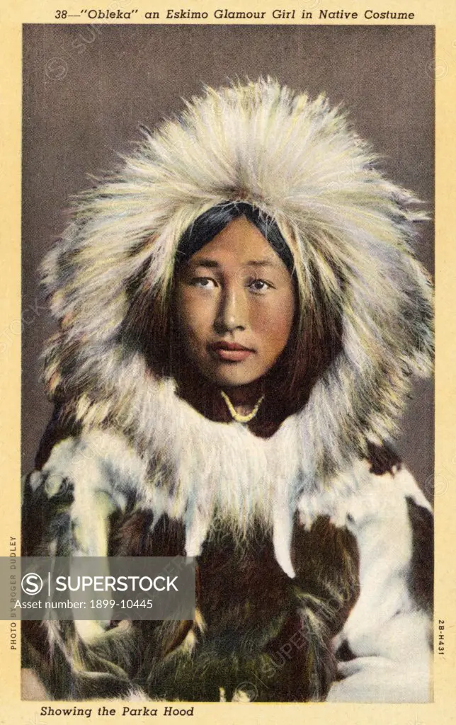 Eskimo Girl Wearing Parka. ca. 1942, Alaska, USA, 38-'Obleka' an Eskimo Glamour Girl in Native Costume. Showing the Parka Hood. 