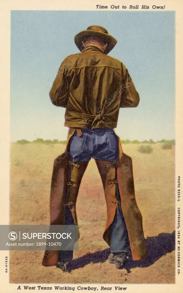 Cowboy Wearing Chaps. ca. 1934, Texas, USA, Time Out to Roll His Own A West Texas Working Cowboy, Rear View. No moving picture acting in his life-just hard work on the range as vividly proven by his wide and powerful shoulders, bow legs, and saddle-worn chaps 