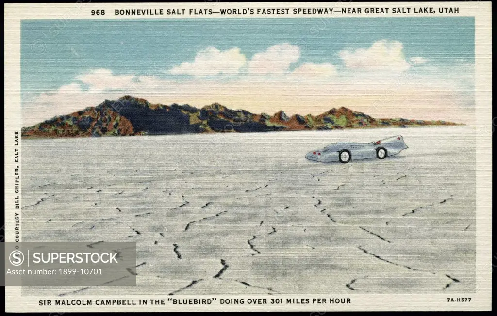 Setting Records on the Bonneville Salt Flats. ca. 1937, Utah, USA, 968. BONNEVILLE SALT FLATS-WORLD'S FASTEST SPEEDWAY-NEAR GREAT SALE LAKE, UTAH. SIR MALCOLM CAMPBELL IN THE 'BLUEBIRD' DOING OVER 301 MILES PER HOUR. The Bonneville Salt Flats is a salt deposit left by the receding of ancient Lake Bonneville which at one time covered about 20,000 sq. miles. This Salt Deposit covers about 159 sq. miles that extend about 9 miles along Western Pacific R. R. Salduro Station lies at about the center. 