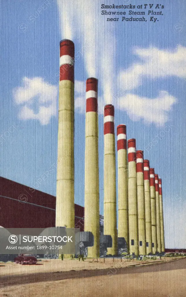 Smokestacks at Shawnee Steam Plant. ca. 1954, Near Paducah, Kentucky, USA, Smokestacks at TVA's Shawnee Steam Plant, near Paducah, Ky. These 10 stacks, one from each generating unit, tower 250 feet above the ground at Shawnee Steam Plant, which is being built by the Tennessee Valley Authority near Paducah, Ky. This $216,000,000 power plant, one of the largest in the world, will generate 1,500,000 kilowatts, part of the power requirements of the new billion dollar Atomic Energy Plant, also near P