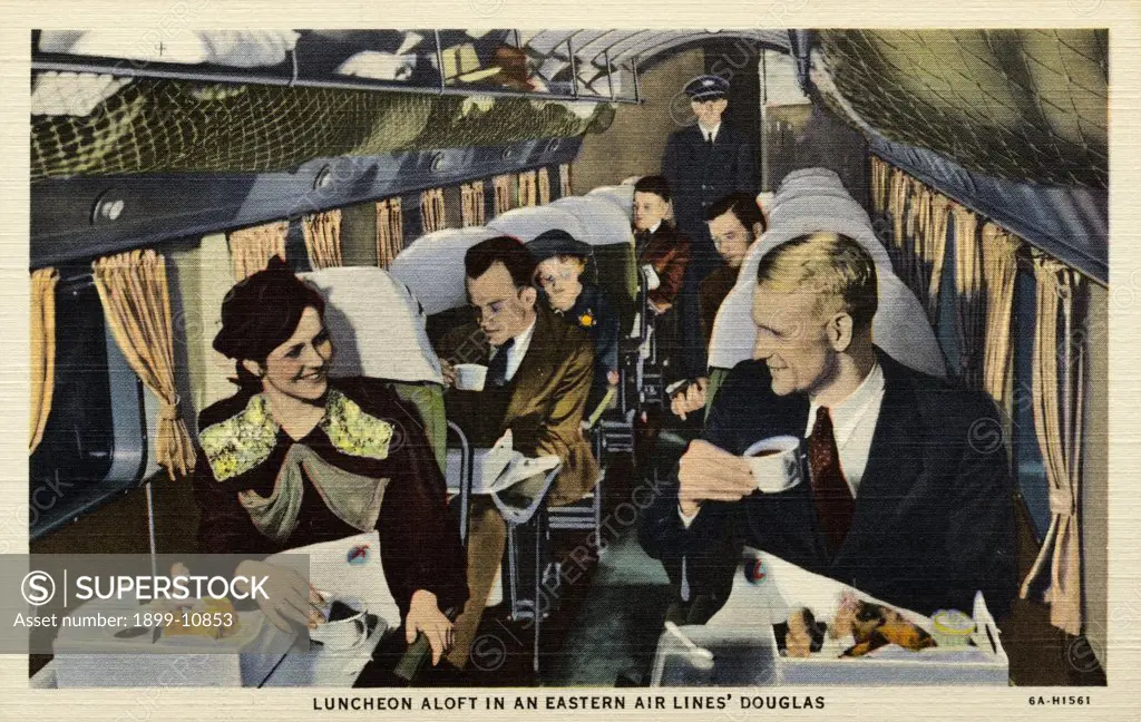 Passengers on an Eastern Airlines Flight. ca. 1936, USA, LUNCHEON ALOFT IN AN EASTERN AIR LINES' DOUGLAS Luncheon aloft, with its hot soups and savory entrees, is a homey, pleasant feature of Eastern Air Lines' Service. The landscape whizzing by, a mile below, lends a thrilling accompaniment to each meal. 