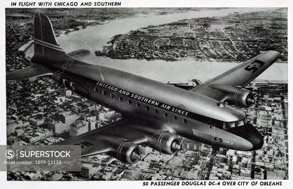 Douglas DC-4 in Flight. ca. 1946, New Orleans, Louisiana, USA, IN FLIGHT WITH CHICAGO AND SOUTHERN. 50 PASSENGER DOUGLAS DC-4 OVER CITY OF ORLEANS 
