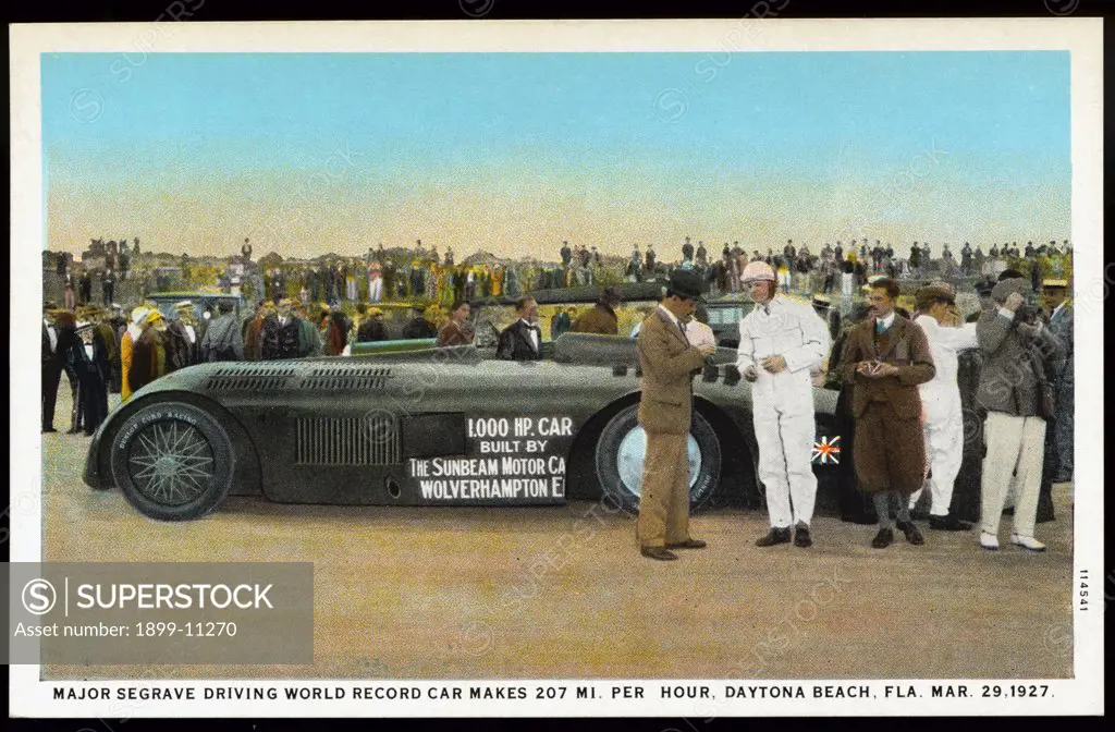 Gathering Around a World Record Car. ca. 1927, Daytona Beach, Florida, USA, MAJOR SEGRAVE DRIVING WORLD RECORD CAR MAKES 207 MI. PER HOUR, DAYTONA BEACH, FLA. MAR. 29, 1927 