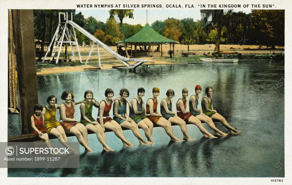 Water Nymphs at Silver Springs. ca. 1925, Ocala, Florida, USA, The absolute clearness and iridescent brilliancy of the water enables you to view through the glass bottom boats the incomparable beauties of the bottom - opalescent caverns - water plants and fishes. There is a flow of 500,000,000 gallons of water every twenty-four hours. These are the largest known Springs in the world. For further information, address Silver Springs Corporation, Ocala, Fla. 