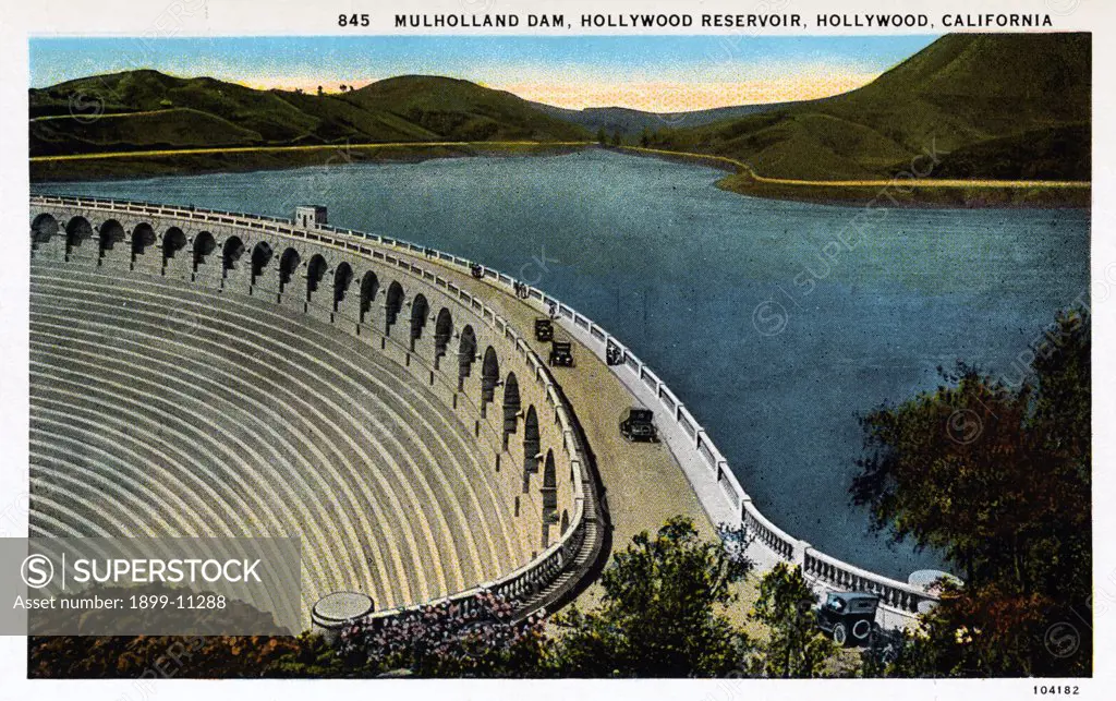 Mulholland Dam and Hollywood Reservoir. ca. 1925, Hollywood, Los Angeles, California, USA, MULHOLLAND DAM. HOLLYWOOD RESERVOIR. Capacity, 2,500,000,000 gallons. Maximum depth of water, 183 feet. 