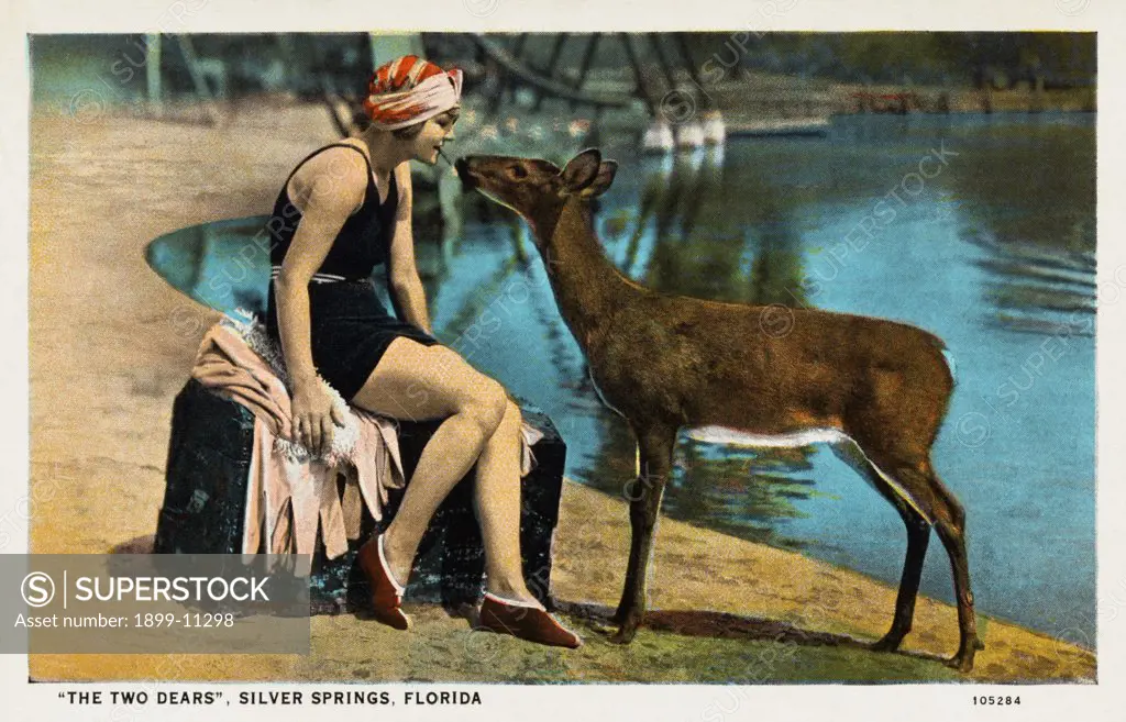 Sunbather with a Deer. ca. 1925, Silver Springs, Florida, USA, SILVER SPRINGS, FLORIDA. Nature's under water Fairyland, shown through glass-bottom boats. Water crystal clear, temperature 72 degrees the year round, bathing and swimming sports in water most ideal. 