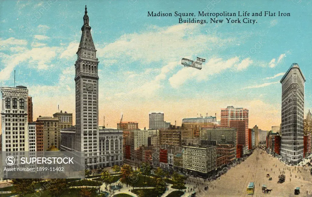 Postcard of Madison Square. ca. 1913, Madison Square, Metropolitan Life and Flat Iron Buildings, New York City. Madison Square showing Fifth Avenue at Right crossed by Broadway at 23rd Street. This tract was set apart in 1811 for parade grounds, 6.84 acres of which still remain. It is bounded by Broadway and Madison Avenue and 23rd and 26th Streets. It was for a generation the centre of the Hotel and Theatre district. 