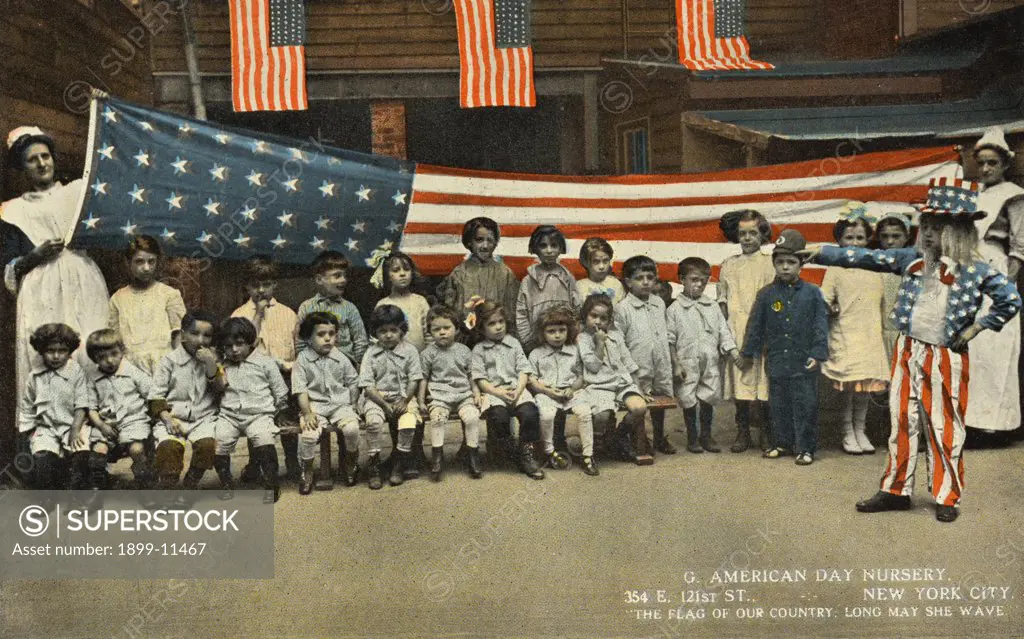 Postcard of American Flag at Nursery School. ca. 1915, G. AMERICAN DAY NURSERY. 354 E. 121ST ST., NEW YORK CITY. 'THE FLAG OF OUR COUNTRY, LONG MAY SHE WAVE' TO THE PUBLIC: Kindly enroll as a member and help us along. The G. American Day Nursery takes care of poor children of all nationalities, and aids all the poor and unfortunate mothers, with food and clothing. 