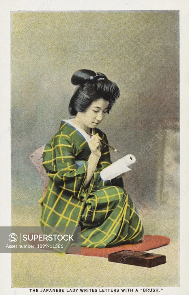 Postcard of Japanese Woman Writing. ca. 1923, The Japanese lady writes letters with a 'brush.' 