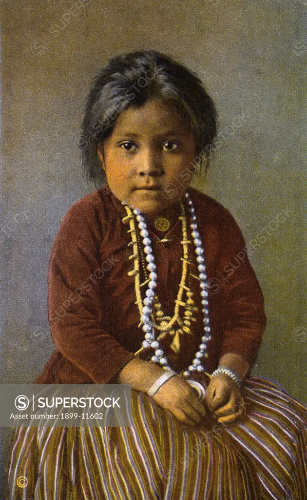 Postcard of Yaz-Yah, A Navajo Girl. ca. 1924, Yaz-Yah, A Navajo Girl. When a traveler journeys to Hopiland in Arizona he crosses a portion of the Navajo reservation. There are some 16,000 Indians on the reservation. Nowhere, however, are they gathered into anything like a village as are the Pueblo Indians or even in groups such as are found among other tribes in the Southwest. They wander here and there like true nomads. The great industry of the women is carding and spinning wool and weaving it