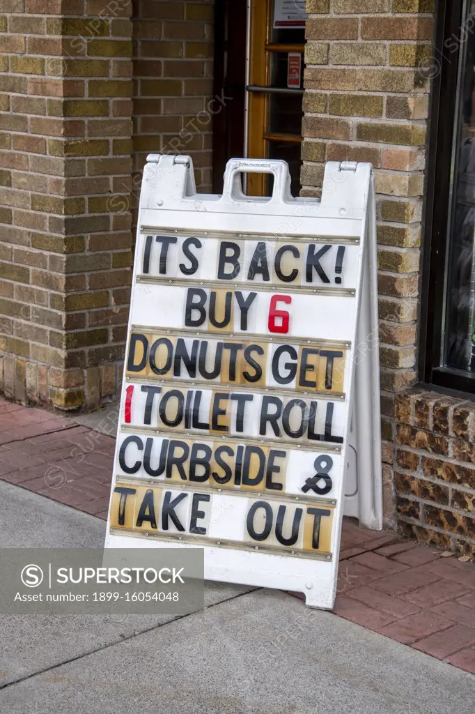 White Bear Lake, Minnesota.  A bakery offers a roll of toilet paper if you buy six donuts because of the empty shelves in the stores due to the coronavirus pandemic. 