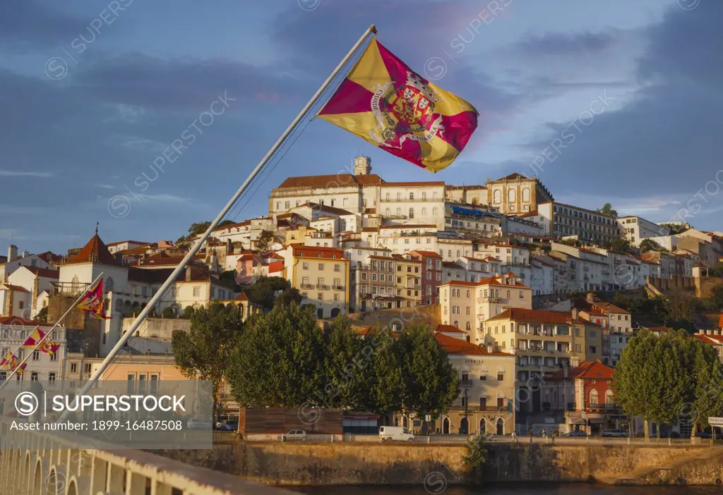 Coimbra, Portugal seen across the Mondego river, The flag is of the city of Coimbra
