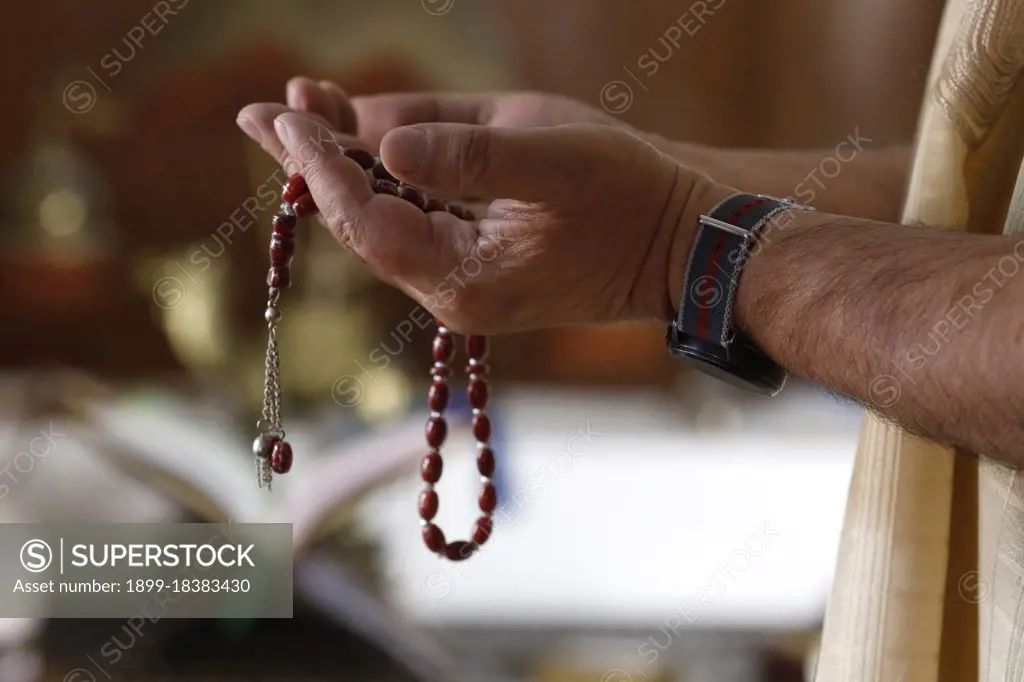 Muslim man pray at home during Ramadan. France. 