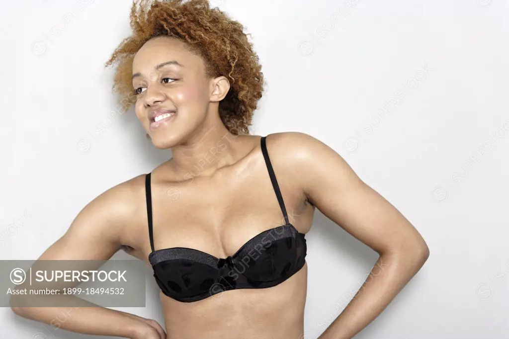 Woman in lingerie smiling in lingerie smiling