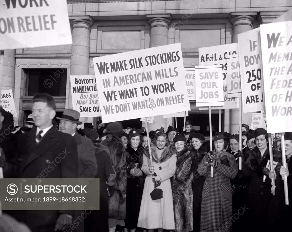 Marchers picketing against a silk boycott circa 1938.