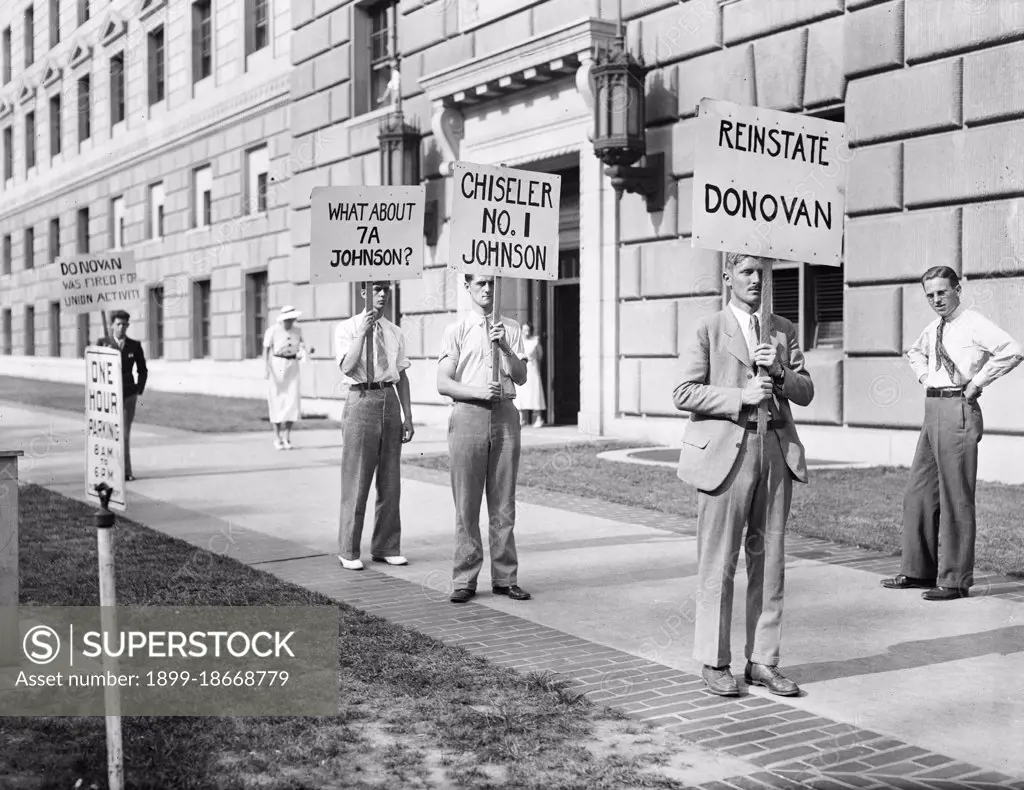 Protesters with signs: 'Johnson unfair to labor,' 'Reinstate Donovan,'  June 1934.