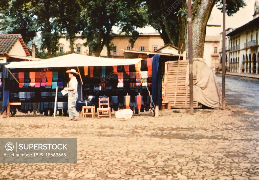 Vendor oustide his stall in Mexico circa 1950-1955.