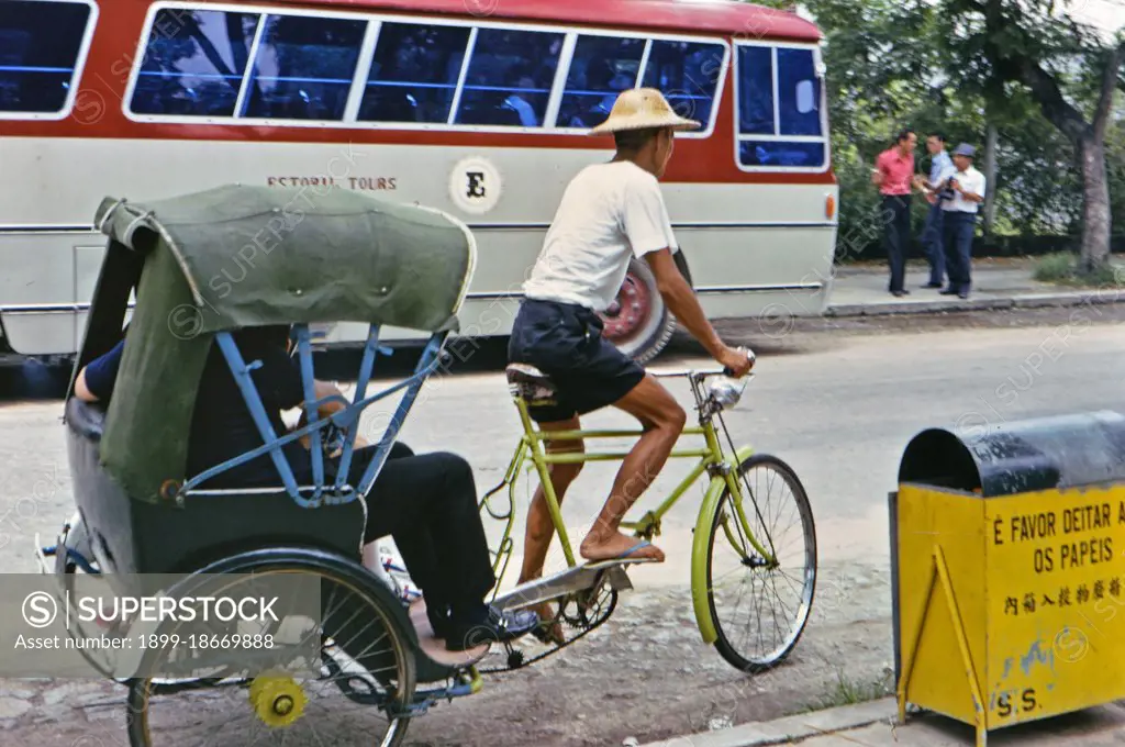 (R) 1973 - Man pedaling a pedicycle in Macau circa early 1970s.