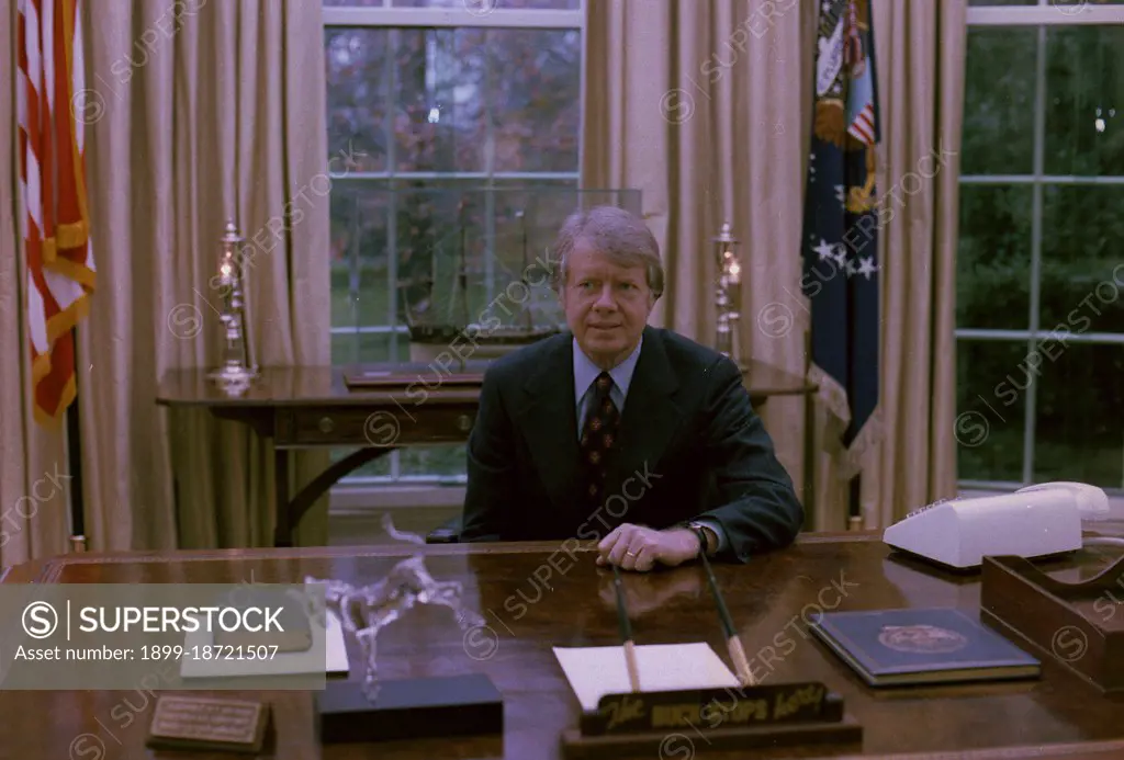 Jimmy Carter at his desk in the Oval Office circa  23 November 1977.